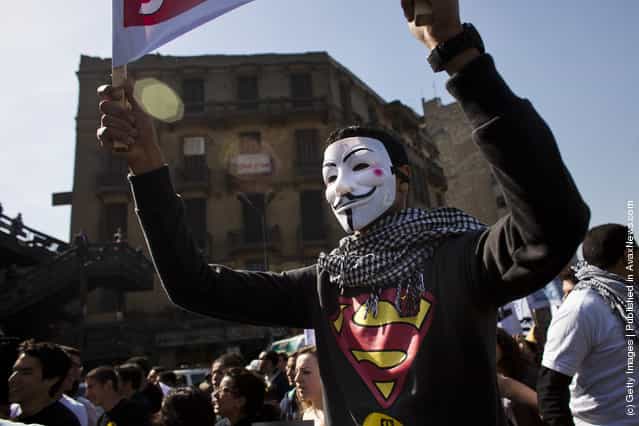 A protester wears a Guy Fawkes mask during a demonstration of students on February 11, 2012 in Cairo, Egypt