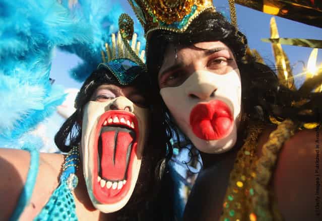 Brazilian revelers pose during Carnival celebrations along Ipanema beach in Rio de Janiero