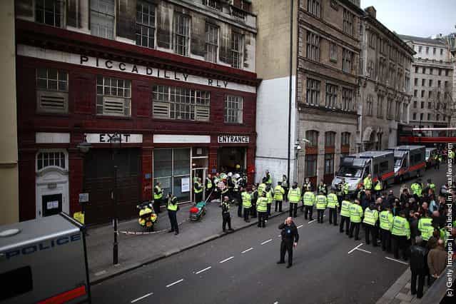 Police evacuate passengers during an emergency services exercise at the disused Aldwych underground station in London
