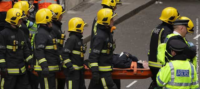 Police evacuate passengers during an emergency services exercise at the disused Aldwych underground station in London