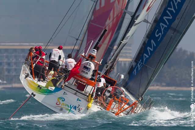 Team Sanya, skippered by Mike Sanderson from New Zealand sails behind CAMPER with Emirates Team New Zealand, skippered by Chris Nicholson from Australia during the start of leg 4 of the Volvo Ocean Race 2011-12