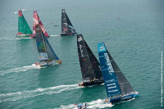 The fleet of Volvo Open 70s power away from the line, at the start of leg 4 of the Volvo Ocean Race 2011-12 on February 19, 2012