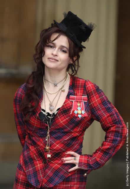 Helena Bonham Carter poses with her Commander of the British Empire (CBE) medal, after an Investiture ceremony at Buckingham Palace