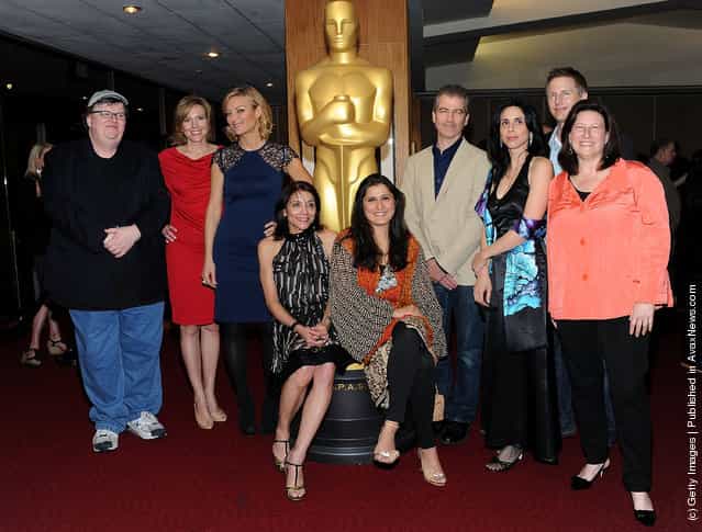 (L-R) Michael Moore, Kira Carstensen, Lucy Walker, Julie Anderson, Sharmeen Obaid-Chinoy, James Spione, Rebecca Cammisa, Dan Junge and Robin Fryday attend the 84th Annual Academy Awards - Nominated Docs! Reception at the Academy of Motion Picture Arts and Sciences