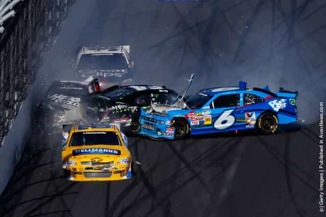 Ricky Stenhouse Jr., driver of the #6 Kelloggs Pop-Tarts Ford, spins into Kyle Busch, driver of the #54 Monster Energy Toyota, putting Kurt Busch, driver of the #1 HendrickCars.com Chevrolet, into the wall during the NASCAR Nationwide Series DRIVE4COPD 300 at Daytona International Speedway