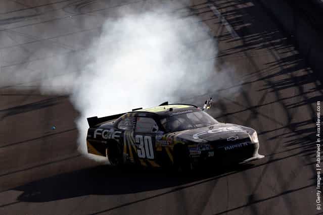 James Buescher, driver of the #30 Fraternal Order of Eagles Chevrolet, celebrates with a burnout after winning the NASCAR Nationwide Series DRIVE4COPD 300 at Daytona International Speedway