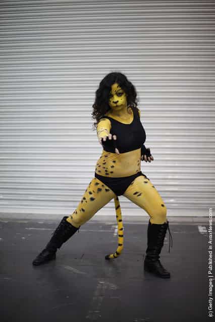 A visitor to the London Super Comic Convention dresses as Cheetah at ExCel