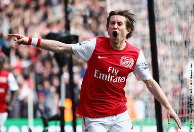 Tomas Rosicky of Arsenal celebrates his goal during the Barclays Premier League match between Arsenal and Tottenham Hotspur at Emirates Stadium