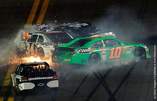 Danica Patrick, driver of the #10 GoDaddy.com Chevrolet, David Ragan, driver of the #34 Front Row Motorsports Ford, and Jimmie Johnson, driver of the #48 Lowe's Chevrolet, spin after an on track incident in the NASCAR Sprint Cup Series Daytona 500 at Daytona International Speedway