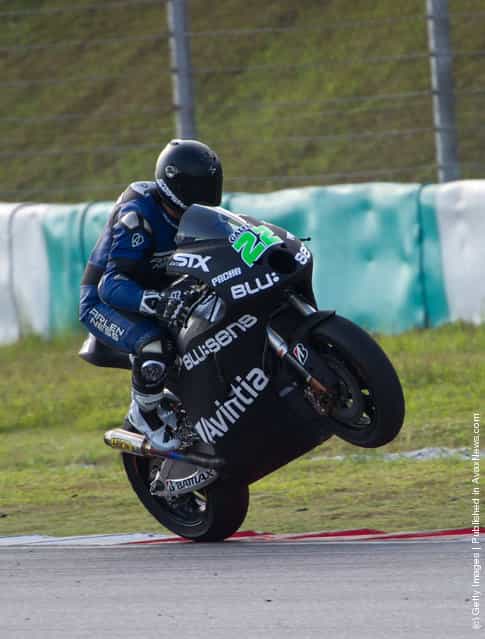 Ivan Silva of Spain and Avintia Racing MotoGP lifts the front wheel during the first day of MotoGP Testing at Sepang Circuit