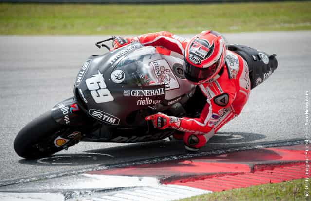 Nicky Hayden of USA and Ducati Marlboro Team rounds the bend during the second day of MotoGP testing at the Sepang Circuit