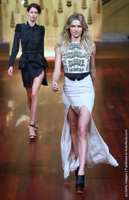 Model Jessica Hart (R) showcases designs by Ellery on the catwalk at the Myer A/W 2012 Collection Launch