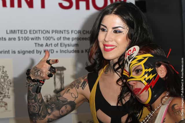 A Sephora client poses with Kat Von D at Kat Von Ds first solo art show New American Beauty at Sephora Antara store
