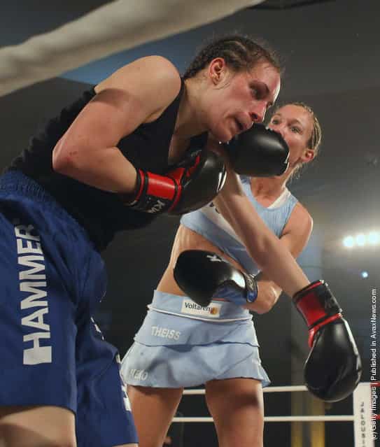 German kickboxer Christine Theiss hits challenger Olja Zerajic of Bosnia during their WKA middleweight title fight at Postpalast