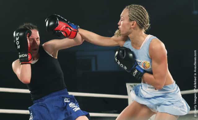 German kickboxer Christine Theiss hits challenger Olja Zerajic of Bosnia during their WKA middleweight title fight at Postpalast