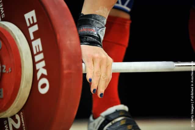Jacquelynn Berube grasps the bar before attempting a 68 kilogram snatch during the 2012 U.S. Olympic Team Trials for Womens Weightlifting