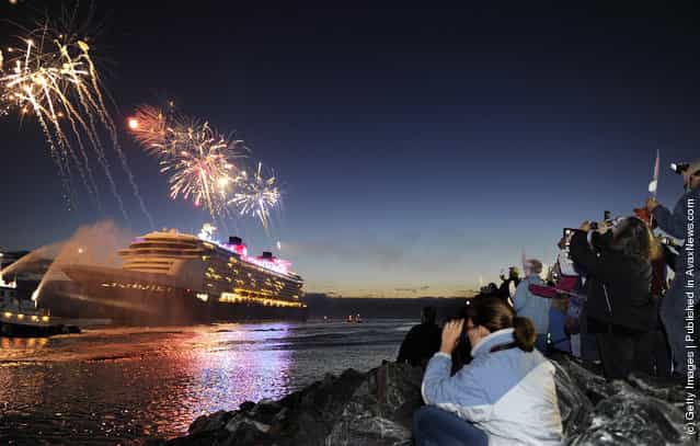 Fireworks light the morning sky March 6, 2012 as the Disney Fantasy, the newest Disney Cruise Line ship, arrives in her home port of Port Canaveral, Florida after traveling nearly 4,700 miles across the Atlantic Ocean from Bremerhaven, Germany
