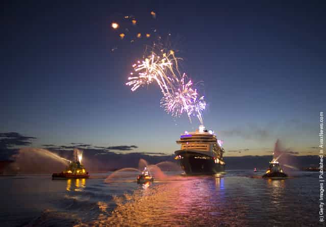 Fireworks light the morning sky March 6, 2012 as the Disney Fantasy, the newest Disney Cruise Line ship, arrives in her home port of Port Canaveral, Florida after traveling nearly 4,700 miles across the Atlantic Ocean from Bremerhaven, Germany