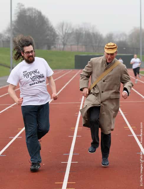 Former 'Monty Python' actor Michael Palin (C) attends a 'Hopathon' world record attempt on Hampstead Heath athletics track on March 3, 2012 in London