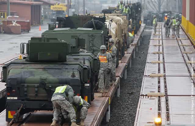 United States Forces Korea (USFK) including soldiers from the 1st Battery, 145th Field Artillery deployed from the United States, load equipment from APS-4 (Army Prepositioned Stocks) stocks onto the railhead during the Key Resolve/Foal Eagle exercise at Camp Carroll on March 6, 2012 in Waegwan, South Korea. The annual combined Field Training Exercise, part of Key Resolve/Foal Eagle 2012, is conducted between the Republic of Korea and United States Forces Korea (USFK) and is one of the largest annual military training exercises in the world