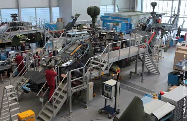 Workers assemble a Eurocopter Tiger military attack helicopter at the Eurocopter plant