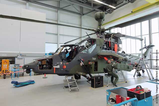 Workers assemble a Eurocopter Tiger military attack helicopter at the Eurocopter plant