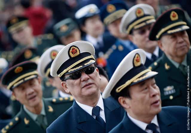 Chinese military delegates arrive at The Great Hall Of The People before the second plenary meeting of the National Peoples Congress (NPC)