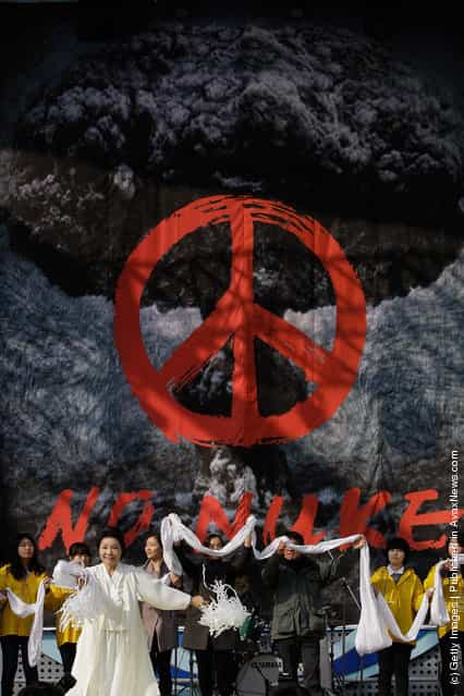 South Korean environmentalists participates in a rally held to commemorate the Fukushima nuclear disaster on the eve of the one year anniversary of Japans earthquake and tsunami
