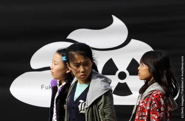 South Korean girls participate in a rally held to commemorate the Fukushima nuclear disaster on the eve of the one year anniversary of Japans earthquake and tsunami