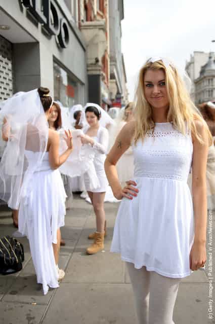 Entertainment One is attempting to set the Guinness World Record for the longest chain of brides in one location at HMV, Oxford Street in London