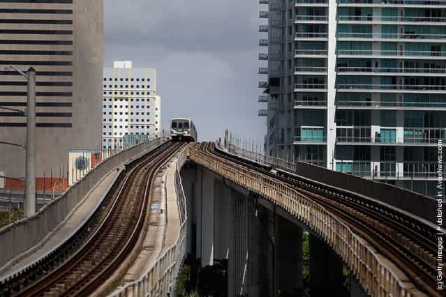 A Miami-Dade county Metrorail train arrives at a station
