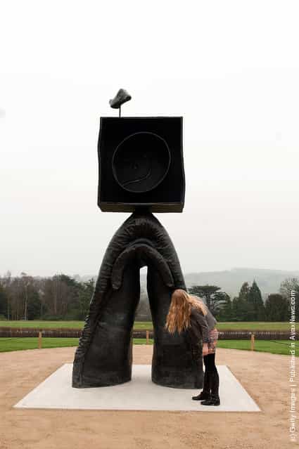 A woman admires Joan Miros sculpture, Personnage Gothique, Oiseau Eclaie (1976) stands in the Yorkshire Sculptire park