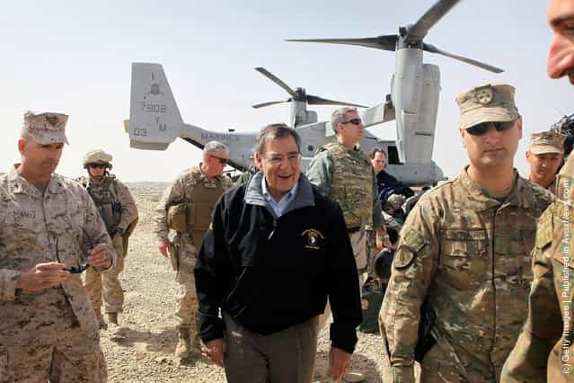 U.S. Secretary of Defense Leon Panetta (C) is greeted after arriving to greet troops March 14, 2012 at Foward Operating Base Shukvani, Afghanistan