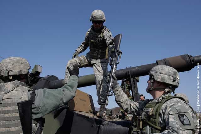 U.S. soldiers from 145th Field Artillery Battalion deployed from the United States and South Korean soldiers participate in the Foal Eagle training exercise at firing point 180 at the Rodriguez Live Fire Range on March 15, 2012 in Pocheon, South Korea