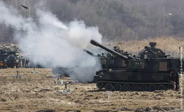 U.S. soldiers from 145th Field Artillery Battalion deployed from the United States fire Paladin self propelled gun during the Foal Eagle training exercise at firing point 180 at the Rodriguez Live Fire Range
