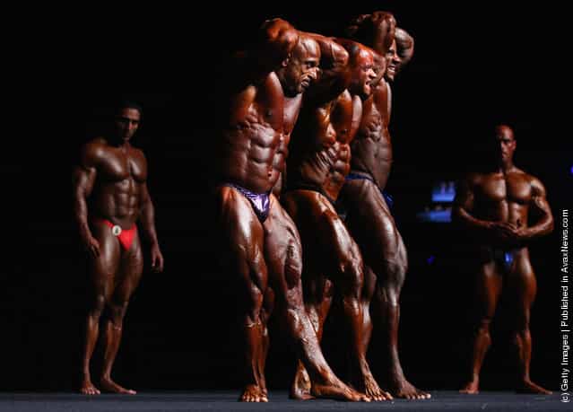 Competitors pose during pre judging for the 2012 IFBB Australian Pro Grand Prix XII at The Plenary