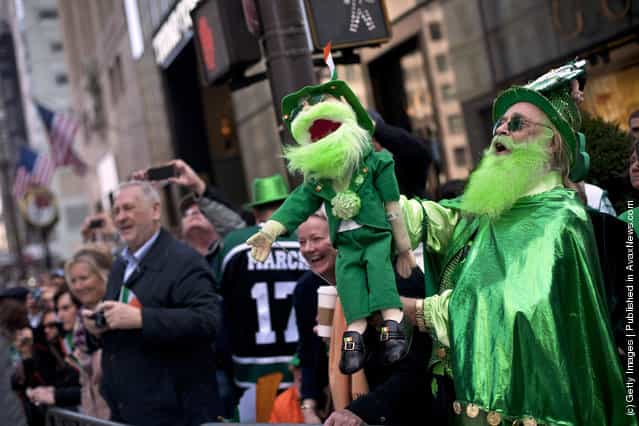 Revelers watch the 251st annual St. Patricks Day Parade March 17, 2012 in New York City
