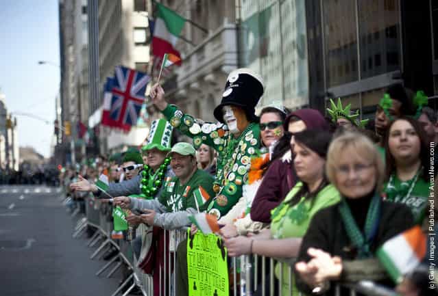 Revelers cheer on the marchers during the 251st annual St. Patricks Day Parade March 17, 2012 in New York City