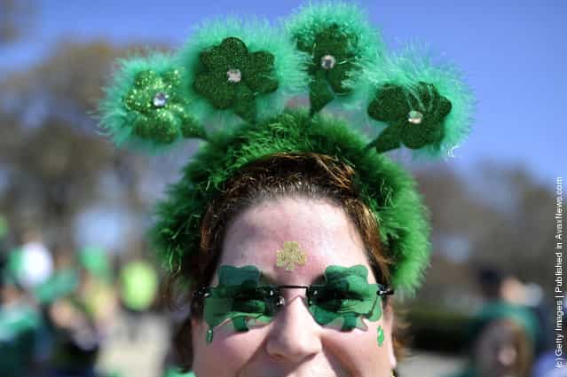 Darcy Zimmermann wears her green sunglasses and headband during the St. Patricks Day parade on March 17, 2012 in Chicago