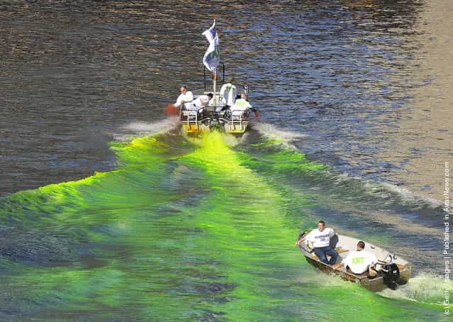 Members of the plumbers union dye the Chicago River green for St. Patricks Day on March 17, 2012 in Chicago