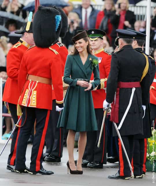 Catherine, Duchess of Cambridge presents shamrocks to members of the 1st Battalion Irish Guards at the St Patricks Day Parade at Mons Barracks