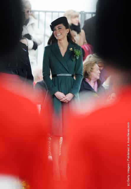 Catherine, Duchess of Cambridge presents shamrocks to members of the 1st Battalion Irish Guards at the St Patricks Day Parade at Mons Barracks on Saturday March 17, 2012 in Aldershot, England