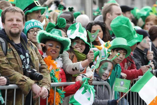 Parade goer watches the St Patricks Day festivities in Dublin, Ireland
