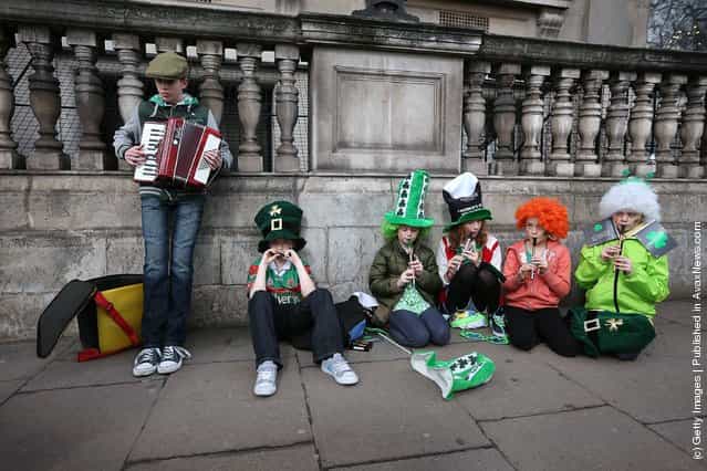 Members the Tir na Nog music group practice before taking part in a St Patricks day parade on March 18, 2012 in London