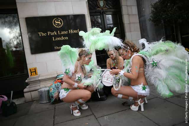 Members of The London School of Samba get ready to take part in a St Patricks day parade