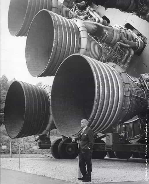 In this handout from NASA/Marshall Space Flight Center. Dr. Wernher von Braun stands next to F-1 Engines of the Saturn V launch vehicle