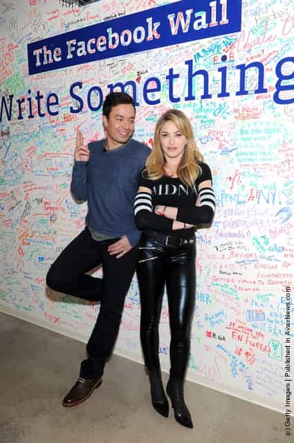 Jimmy Fallon and Madonna pose at the Facebook wall before their livestream interview at the Facebook offices