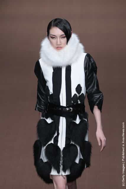 A model showcases designs on the catwalk during Magic Fur Wu Xuekai Collection A/W 2012-2013 of China Fashion Week at 751D.Park Workshop