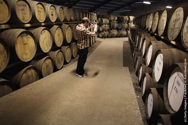 Tourists pay a visit to Edradour distillery on March 26, 2012 in Pitlochry, United Kingdom