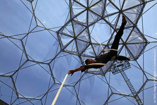 Circus performer Kevin McIntosh climbs a aerial rope as he performs at a preview for NoFit State Circus new summer show at the Eden Project